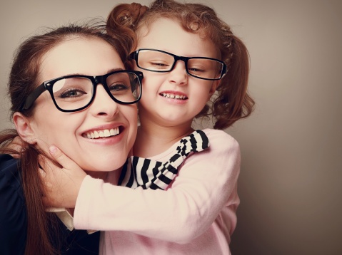 494434659_Loving_happy_mother_and_smiling_daughter_hugging._Vintage_closeup_portrait.jpg